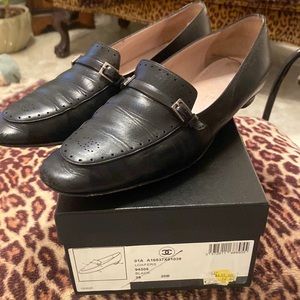 Black Chanel loafer with split heel styling